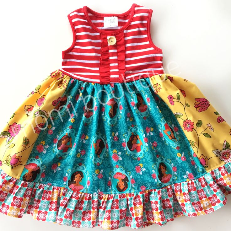 Our Elena of Avalor dress is fashioned in our knit style bodice & a cotton ruffle skirting, perfect for wowing the crowd! Hand designed from a delightful mix of prints that please & colors that pop. Great for Magical vacations, Disney days, gift giving, theme parties, & everyday wear!All designs are tagged in the even size.12mo/18mo: 17" 2/3: 21" 4/5: 24" 6/7: 26" 8" 28"Chest width unstretched: sz 12mo/18mo: 18"2/3: 20" 4/5: 22.5" 6/7: 26" 8: 28"Ships in 2-5 days! Casual Multicolor Ruffled Skirt Dress, Casual Multicolor Dress With Ruffled Skirt, Casual Multicolor Ruffled Dress, Blue Cotton Dress With Ruffled Skirt, Playful Fitted Twirl Dress With Floral Print, Beach Multicolor Ruffled Dress, Multicolor Ruffle Twirl Dress For Playtime, Multicolor Ruffled Twirl Dress For Playtime, Playful Multicolor Floral Print Twirl Dress