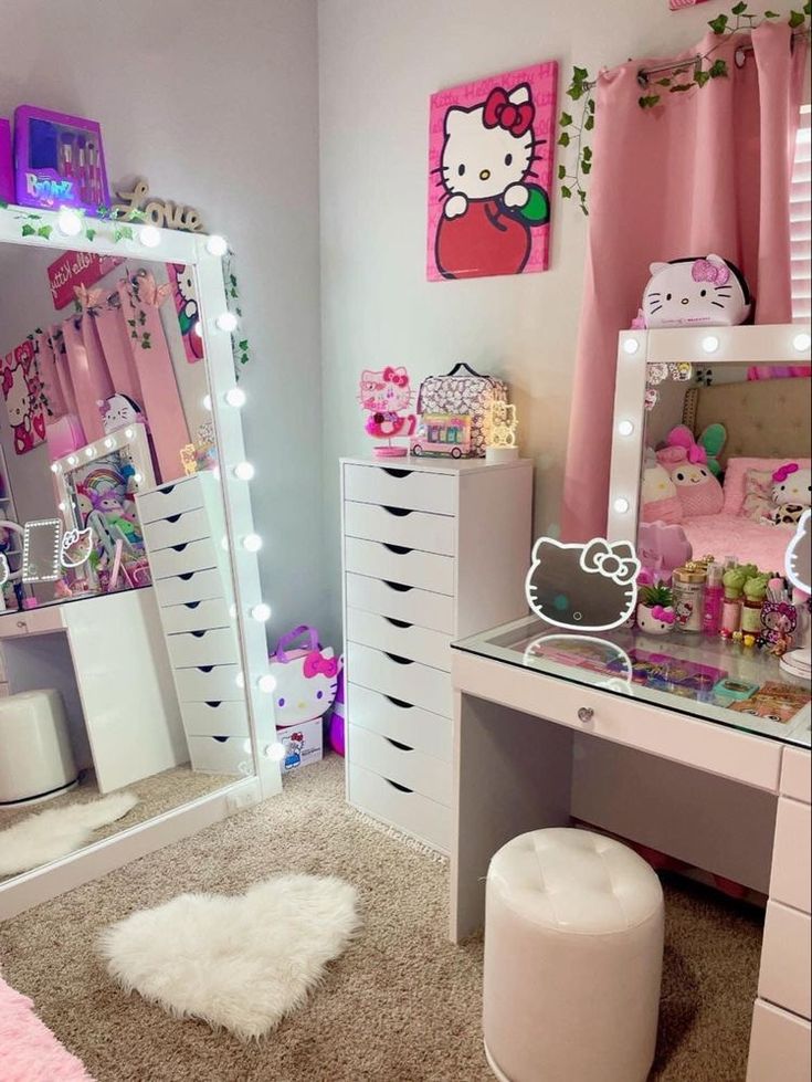 a bedroom with hello kitty decorations on the walls and vanity, mirror, stools, and lights