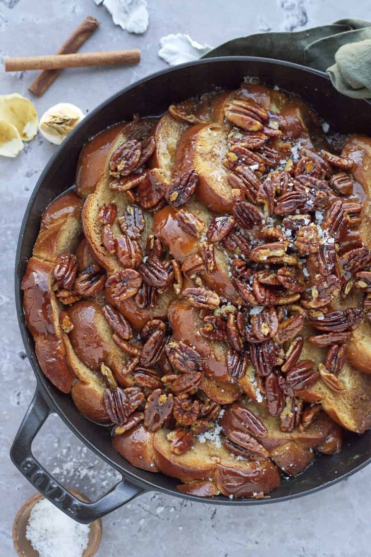 a skillet filled with bread and pecans