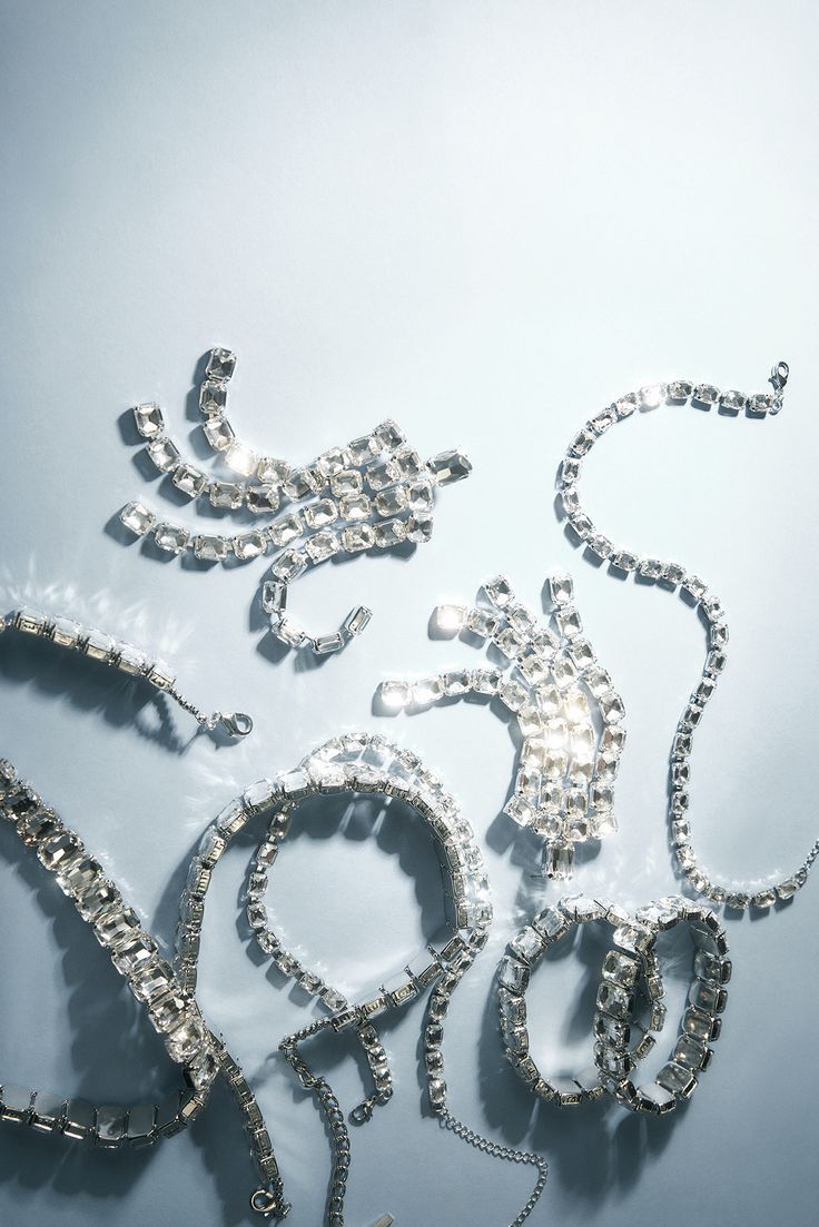 several pieces of jewelry are displayed on a table