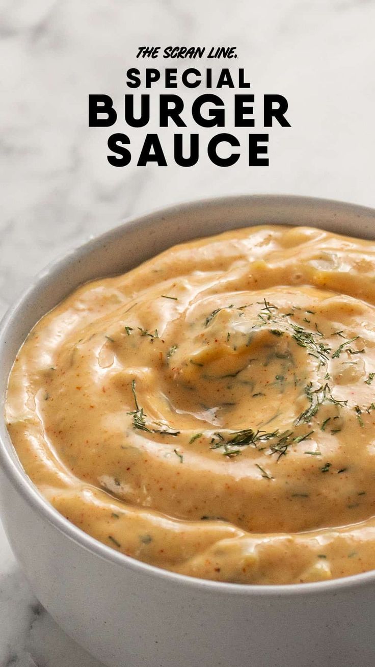 a white bowl filled with sauce on top of a table