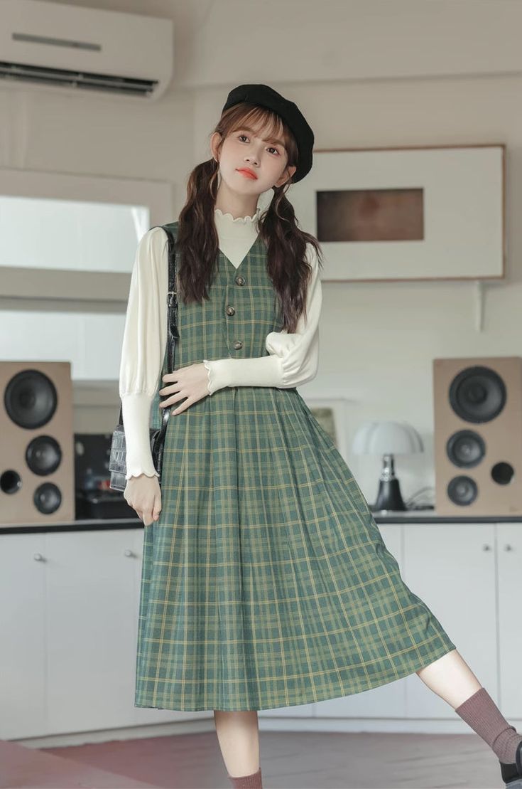 Pinafore dress with a v-neckline, curved button-front, side pockets and a midi skirt. S: 34.5" chest and waist, 42" lengthM: 36" chest and waist, 42" lengthL: 37.5" chest and waist, 42" length Green V-neck Maxi Dress With Button Closure, Casual Green V-neck Dress For Fall, V-neck Maxi Dress With Pockets For Daywear, Casual Long Sleeve Pinafore Dress, Fall V-neck Maxi Dress With Button Closure, Casual Green V-neck Knee-length Dress, Casual Green Knee-length V-neck Dress, Fall Midi Dress With Pockets, Fall Midi Dress With Buttons