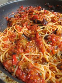 spaghetti with tomato sauce and mushrooms in a skillet