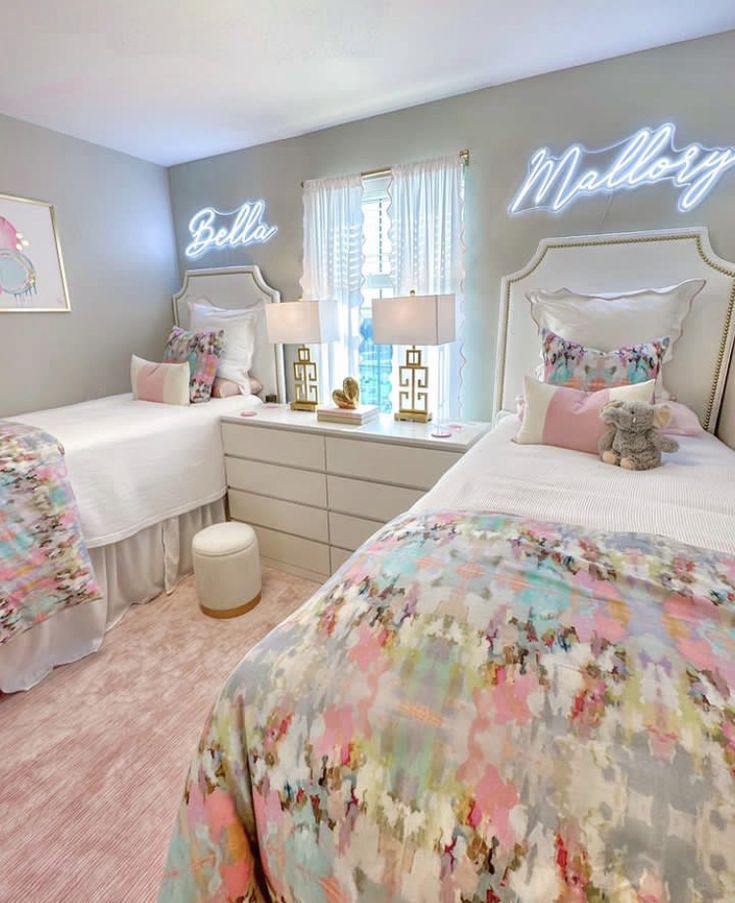 two twin beds in a bedroom with pink carpet