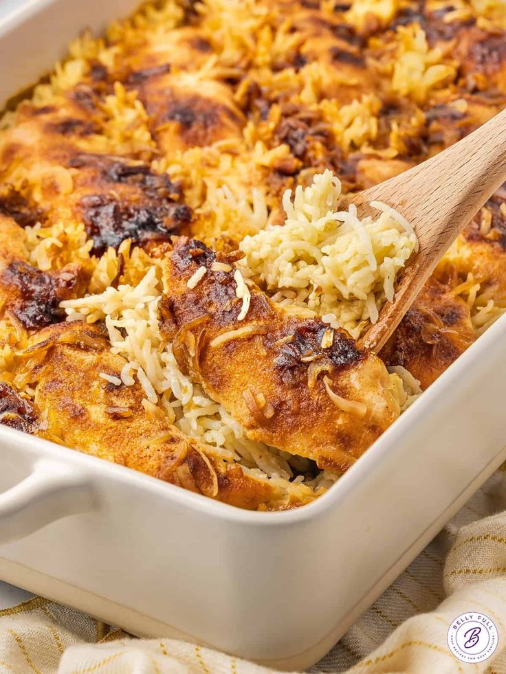 a casserole dish with rice and meat in it