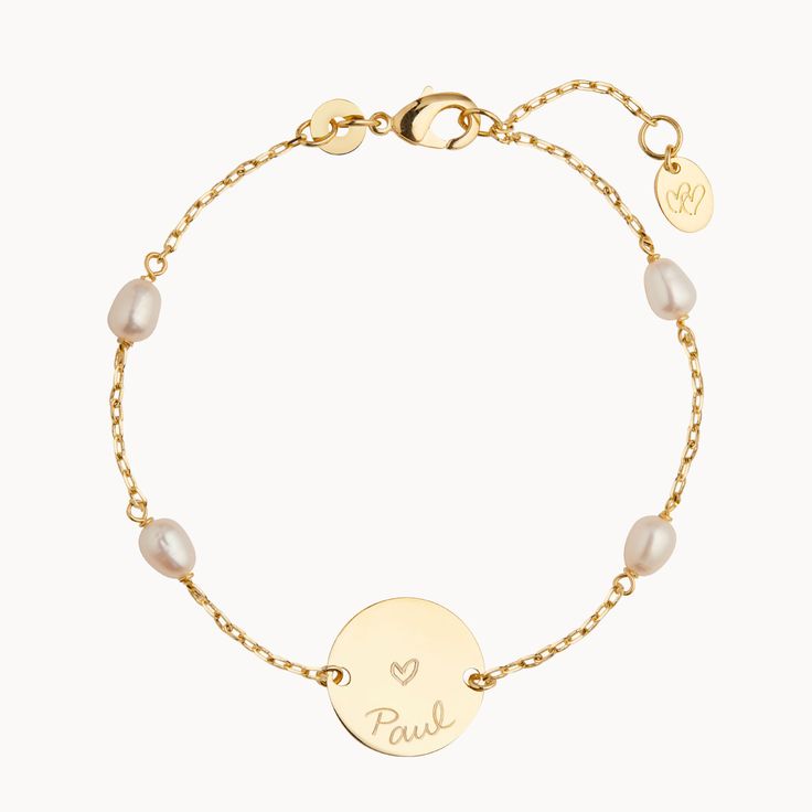 Perfect for all occasions, this personalized engraved Pearl Pastille Chain Bracelet features a delicate chain and freshwater pearls. Add a unique hand-engraved message on the front and reverse of the disc and create a sentimental keepsake, perfect for weddings, bridesmaid gifts or everyday wear.18K Champagne Gold Plated or 925 Sterling SilverBracelet measures 7, adjustable to 6.3Pastille Charm: 0.6 x 0.6Set with 4 freshwater pearlsEngraved by hand in our workshopSent with love from Paris in a co Personalized Pearl Jewelry, Personalized Round Pearl Jewelry, Delicate Personalized Bracelet For Anniversary, Customizable Elegant Name Bracelet, Personalized Pearl Jewelry For Anniversary, Dainty Sterling Silver Name Bracelet For Wedding, Elegant Personalized Round Pearl Bracelet, Personalized Pearl Bracelet, Elegant Gold Name Bracelet With Engraved Text