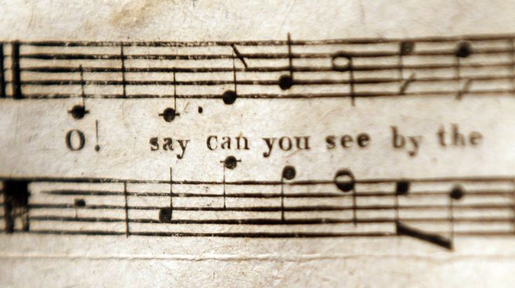 an old sheet with music notes on it that says, i say can you see by the light?