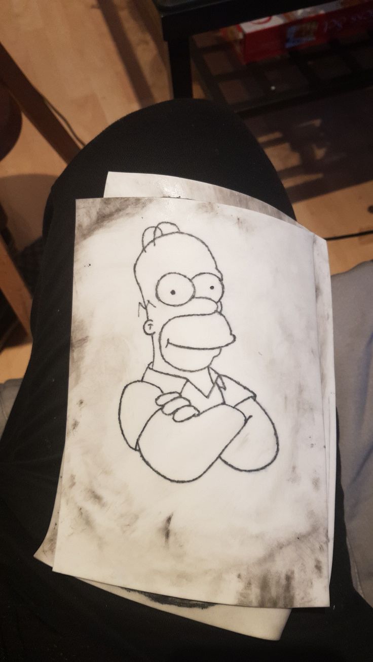 a drawing of homer the simpsons on a piece of paper