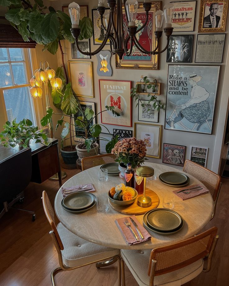 a dining room table with plates and bowls on it