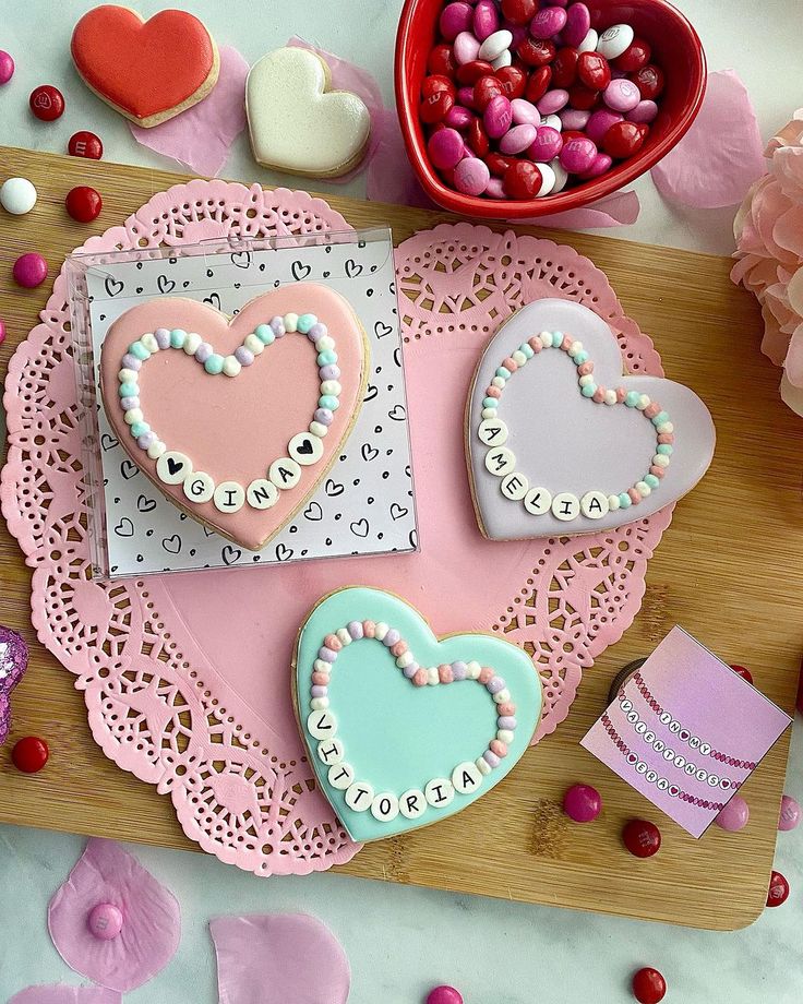 heart shaped cookies and candy on a table