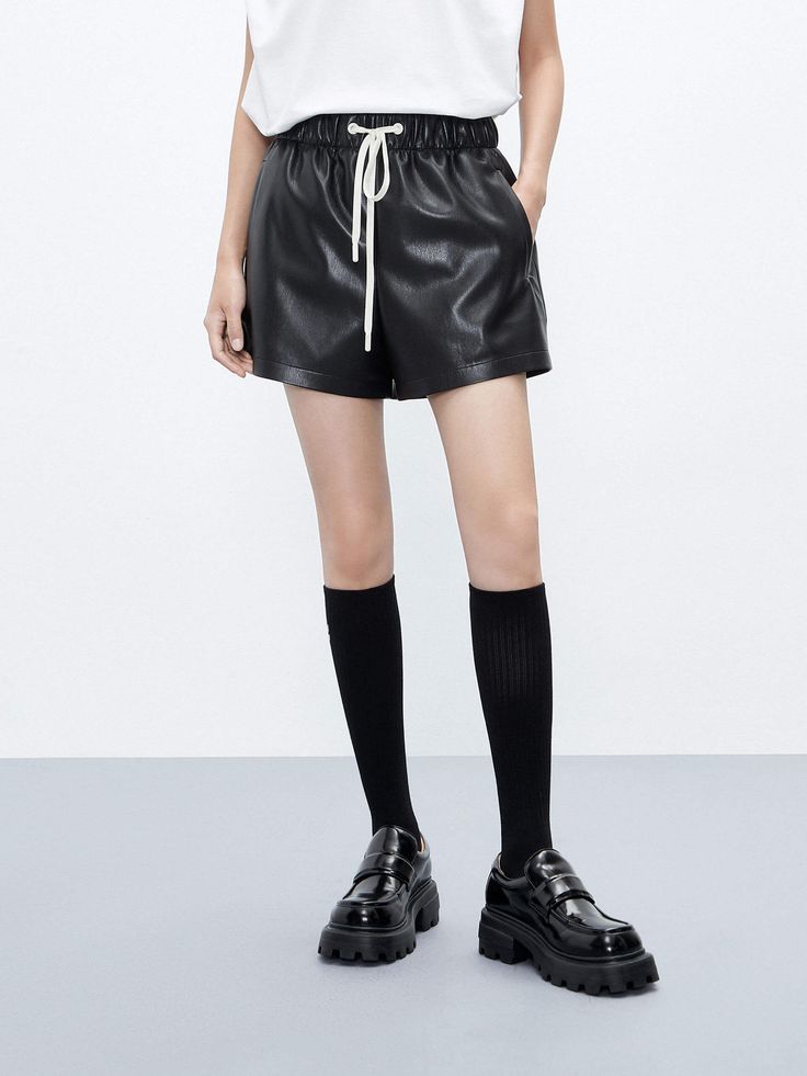 MO&Co. Women's Faux Leather Solid Color Casual Drawstring Shorts in Black Black Leather Bottoms With Built-in Shorts, Black Leather High-waisted Shorts, Black Shorts With Elastic Waistband For Fall, Black Leather Shorts For Fall, Casual Black Leather Shorts, Casual Leather High-waisted Shorts, Casual High-waisted Leather Shorts, Casual Leather Shorts, Casual Short Leather Bottoms