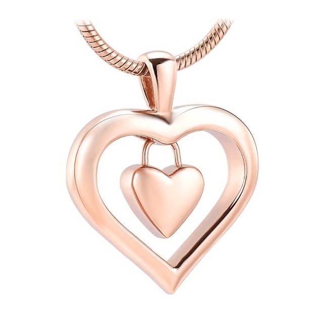 You can carry the remains of that person you love very close to your heart and wherever you are, show your love for that loved one. Do it with this beautiful Heart Charm Cremation Pendant that is made of high quality Stainless Steel that contains a small heart inside a larger heart. In order to fill this cremation pendant with cremains, it is necessary to open a hidden screw that is at the base of the heart. Accepts a small amount of ashes. We recommend putting a dab of glue on the screw to ensu Keepsake Double Heart Charm Necklace, Keepsake Double Heart Necklace With Heart Charm, Valentine's Day Open Heart Charm Necklace, Rose Gold Necklaces For Memorial On Valentine's Day, Double Heart Locket Necklace For Keepsake, Heart Beads Jewelry For Keepsake, Double Heart Keepsake Jewelry For Valentine's, Double Heart Necklace For Mother's Day Keepsake, Double Heart Locket Necklace Keepsake