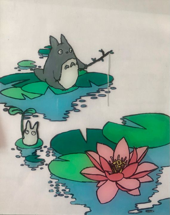 an image of some water lilies and a totoro