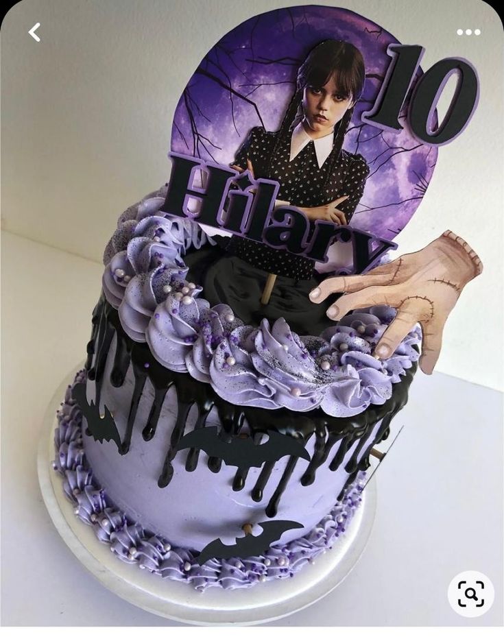 a purple and black birthday cake with the number 10 on it