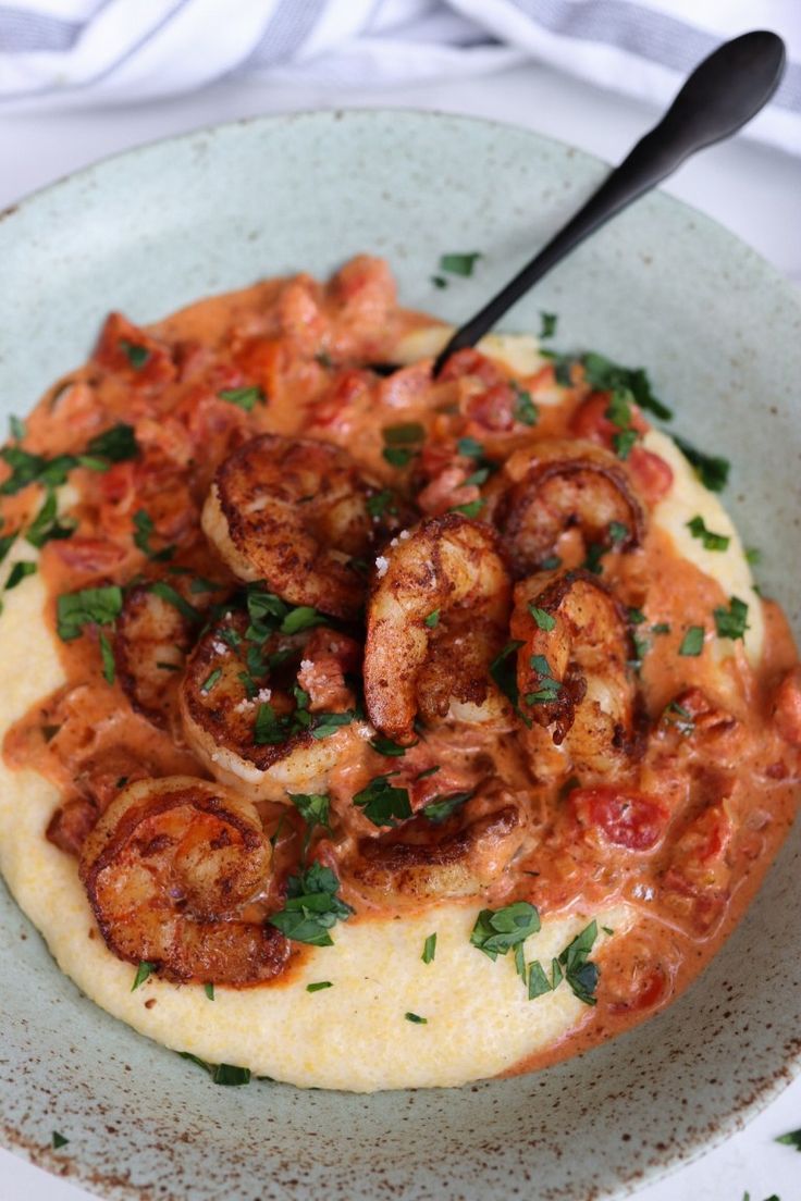 shrimp and grits with tomato sauce in a bowl