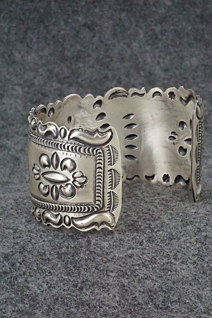 This stunning and intricate sterling silver bracelet was made by Navajo silversmith Eugene Charley. The inside is signed and stamped sterling.Size: 6" (will fit up to a 7 3/8" wrist)Gap: 1 3/8"Width: 1 1/2"Free shipping on all orders! We ship with USPS and always include tracking. All orders ship within a day of payment.Returns are accepted up to 30 days after you receive your order. Just send us a message. Our shop offers cash back or store credit. The item must be returned in new condition. Sterling Silver Bracelet, Sterling Silver Bracelets, Happy Valentines Day, Happy Valentine, Silver Bracelet, Gap, Valentines, Size 6, Bracelet