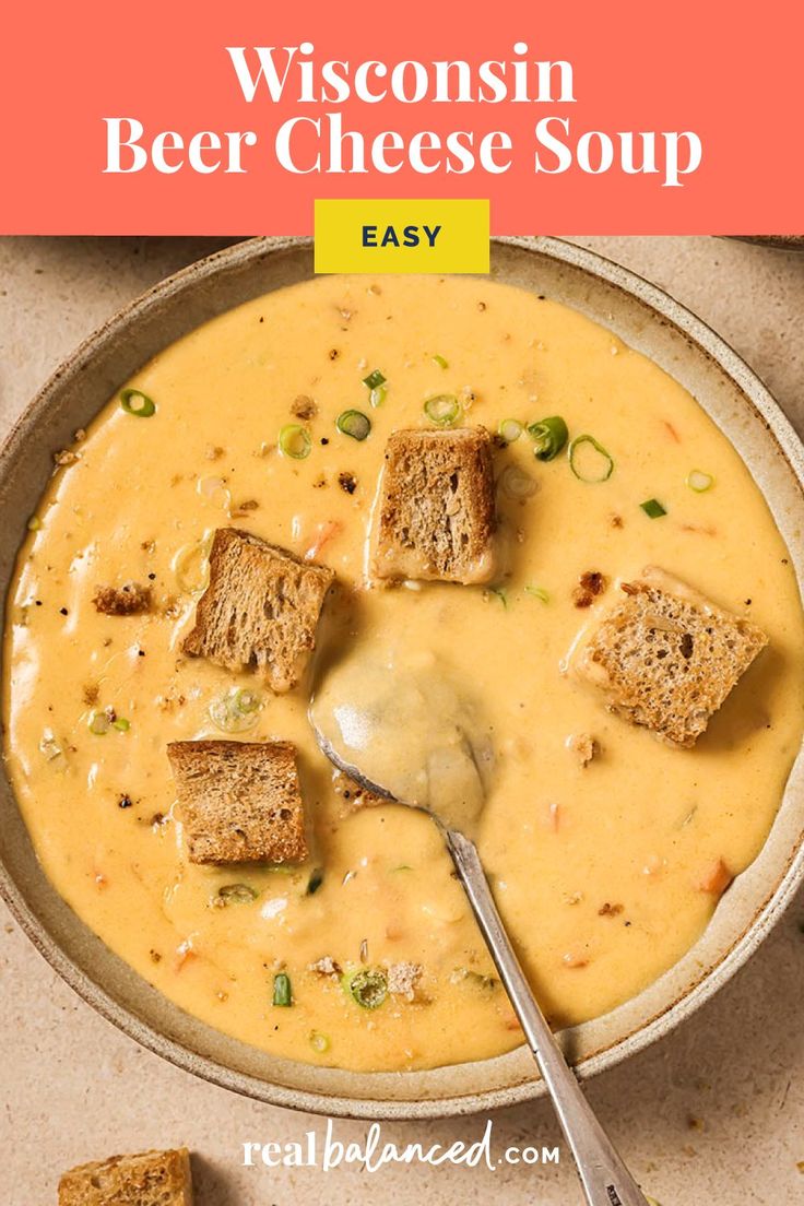 a bowl of wisconsin beer cheese soup with croutons