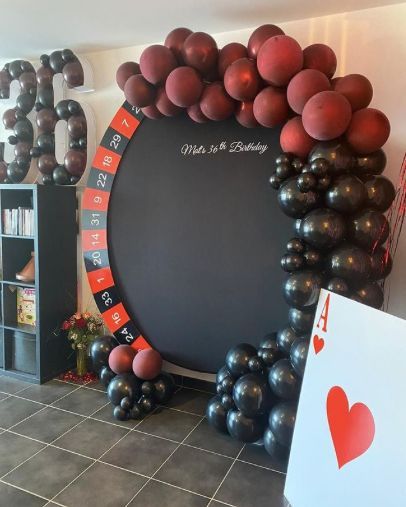 balloons are arranged in the shape of a circle with numbers on it, and an i love you sign