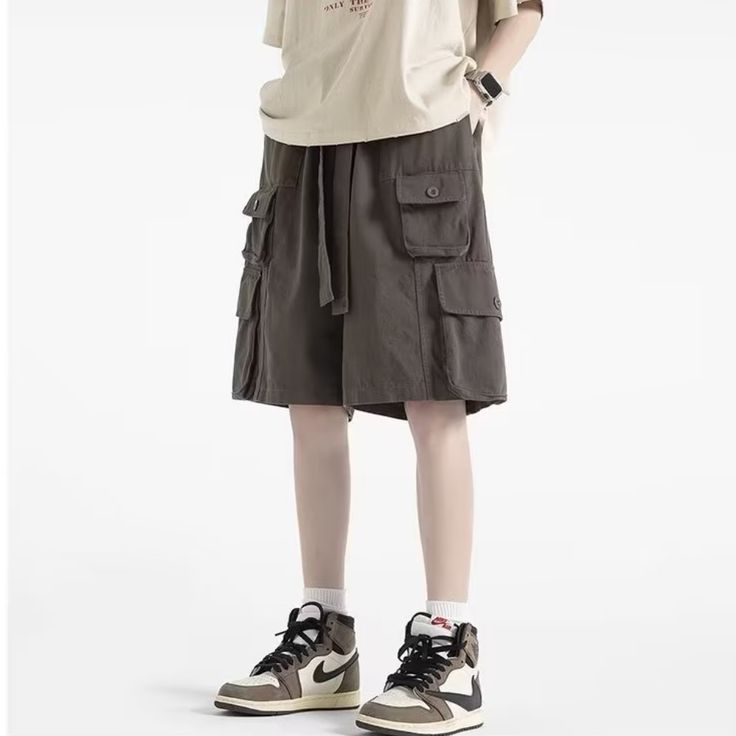 Take your wardrobe to the next level with these stylish Solid Multi-Pocket Cargo Shorts. Featuring multiple pockets for convenience, they offer an aesthetically pleasing accent to any outfit. With a wide range of sizes, they are perfect for a night out, casual event, or everyday use. Features: -100% Polyester -Mid-rise waist -Belted Waistband -Multi-Pocket -Solid Color -Regular Fit -Vintage style Baggy Utility Shorts With Pockets, Baggy Cargo Shorts With Pockets For Summer, Summer Streetwear Cargo Pants With Pockets, Casual Relaxed Fit Bottoms With Pockets, Casual Short Length Pants With Pockets, Khaki Short Cargo Pants With Patch Pockets, Khaki Short Length Cargo Pants With Patch Pockets, Solid Color Cargo Shorts With Pockets For Streetwear, Short Cargo Pants With Patch Pockets For Streetwear