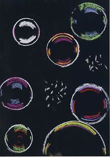 an image of soap bubbles drawn on a blackboard with colored pencils and crayons