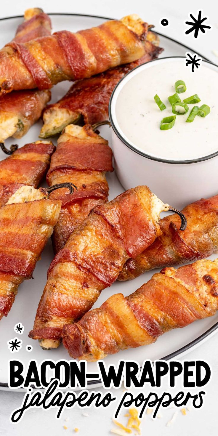 bacon wrapped jalapenos on a plate with ranch dip