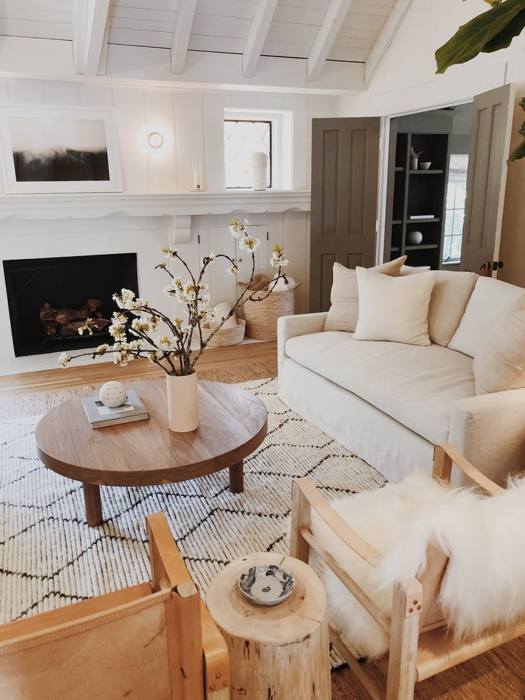 a living room filled with furniture and a fire place