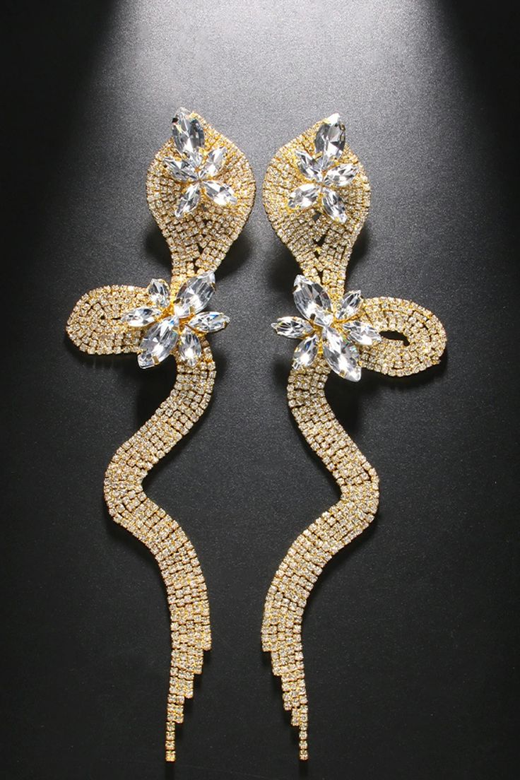 Introducing our Crystal Serpent Diamond Earrings, a mesmerizing blend of diamonds and crystals in a sleek serpent design. These earrings captivate with their unique and elegant charm, combining the brilliance of diamonds with the allure of crystal elements. The serpent shape adds a touch of mystique, making them a statement piece for any occasion. Elevate your style and embrace the enchantment with these stunning diamond and crystal earrings. The Serpent, Diamond Drops, Quality Diamonds, Unique Charms, Crystal Earrings, Everyday Fashion, Gold Earrings, Silver Gold, Silver Earrings