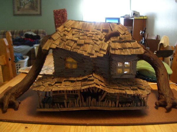 a house made out of sticks on top of a table