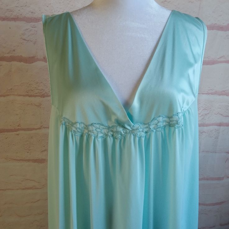 Seafoam Green Vintage Nightgown 3XL Absolutely beautiful color , silky and satiny Like a cool summer breeze this one is!! From Vanity Fair XXXL- tag size Material~ Nylon Find a garment you love, lay it flat and measure it, then compare! All measurements taken lying flat Shoulder to shoulder- 17 inches Armpit to Armpit 24 inches Hips~ approx 29 inches Top of strap to bottom hem~ 36 inches This gown is in excellent condition. Last photo shows area of repair  gown has been laundered in mild plant-based detergent and tumbled dry Vintage clothing is over 20 years old and residual odors may be present even after the cleaning/laundering interventions that I have taken. You are buying the item in the photo All sales are final. Please reach out if you need another photo, measurement or have a quest