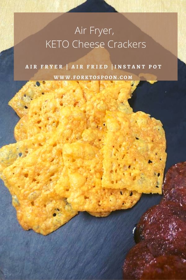 an air fryer keto cheese crackers on a blue plate with sauces