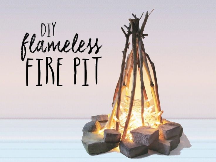 a fire pit made out of sticks with the words diy flameless fire pit