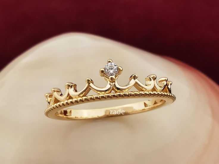 Dainty 14k Solid Gold Crown Ring You are the king around here! You can declare yourself a king with a 14-karat gold ring that we designed as a king's crown. After all, you've accomplished a lot, you can handle this ;) When it comes to a diamond alternative, don't hesitate to  consult an me. 1.70 Gram, 14K Solid Gold, Zircon Stone, Crown Ring GIFT  ❥ Your product will be sent in a nice high quality jewelry box. ❥ If you have a gift note at the time of purchase, I will be happy to write it on the Queen Ring Design Gold, 14k Gold Crown Design Diamond Wedding Ring, 14k Gold Diamond Ring With Crown Design, 14k Gold Crown Design Anniversary Rings, 14k Gold Diamond Crown Design Promise Ring, Anniversary Crown Shaped 14k Gold Ring, Gold Crown Design Ring, Yellow Gold Diamond Ring With Crown Design As Gift, Single Stone Rings Gold