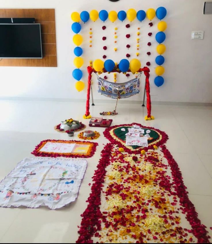 a room with balloons and decorations on the floor