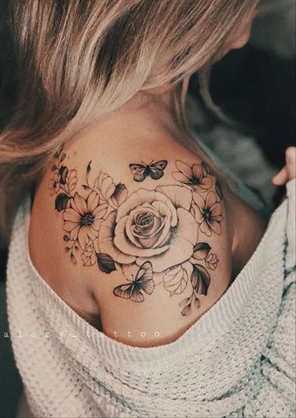 a woman with a flower tattoo on her shoulder