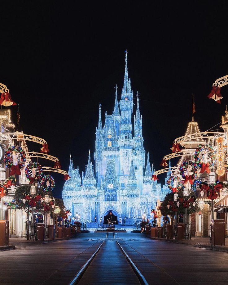 the castle is lit up at christmas time