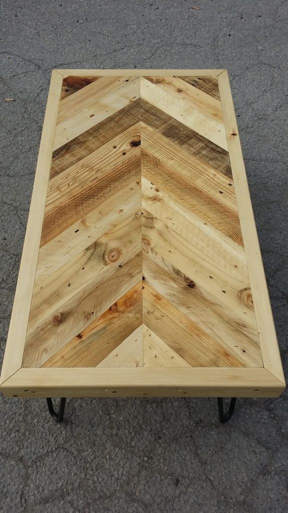 a coffee table made out of wooden planks