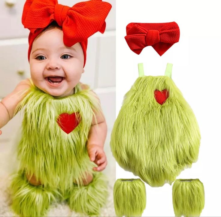 a baby wearing a green monster costume with red hearts on it's chest and two matching hair clips