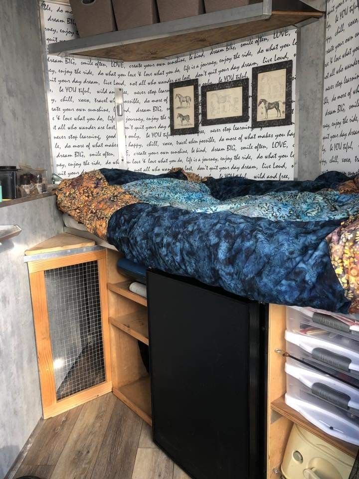 a bed sitting in the corner of a room