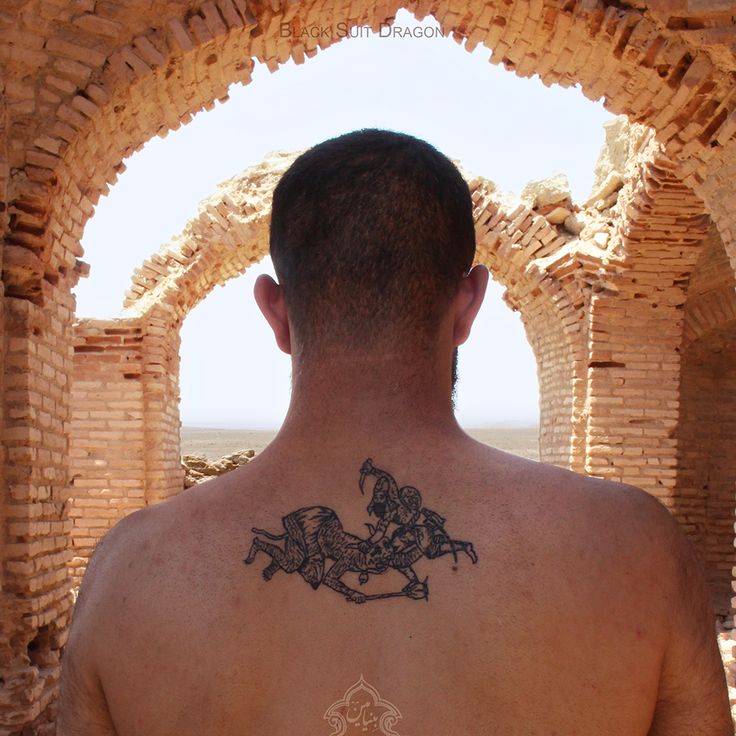 a man with a horse tattoo on his back