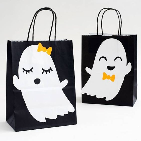 two black and white bags with ghost faces on them, one has a yellow bow