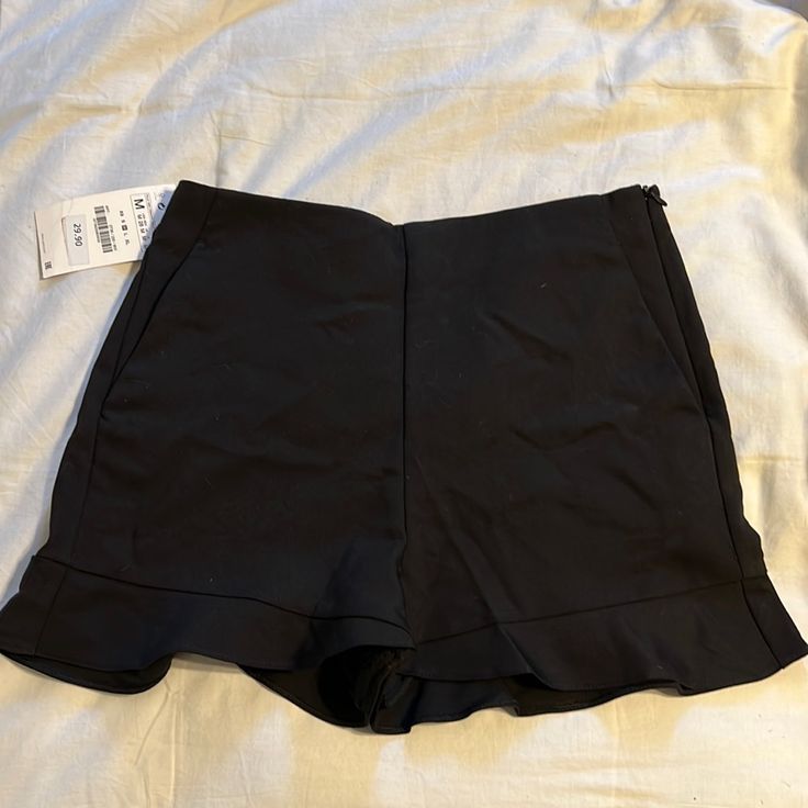 Black Zara High Waisted Shorts Side Zipper Ruffle Detail Brand New Ss 2019 Zara Casual Bottoms With Ruffles, Chic Zara Bottoms With Ruffles, Chic High Waist Ruffled Shorts, Black Ruffled Bottoms For Night Out, Ruffled Bottoms For Spring Date Night, Ruffled Bottoms For Date Night In Spring, Chic High Waist Ruffle Shorts, Spring Date Night Ruffled Bottoms, Black Bottoms With Ruffles For Spring