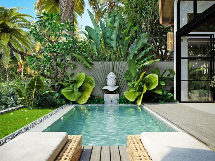 an outdoor swimming pool surrounded by greenery and palm trees, with two lounge chairs facing the pool