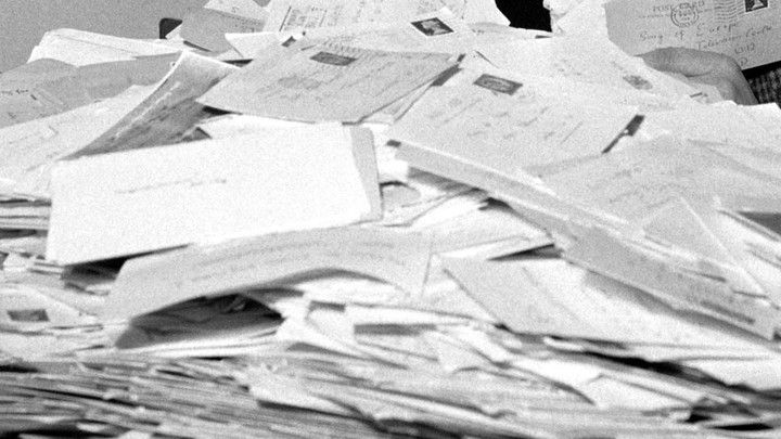 a pile of papers sitting on top of a table