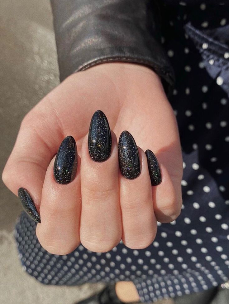 Black Nails With Gold Sparkles, Almond Nails Alternative, Black Galaxy Nails Acrylic, Black Sparkly Nails Almond, Glittery Black Nails Short, Light Black Nails, Black Sparkling Nails, Shimmery Black Nails, Reputation Themed Nails