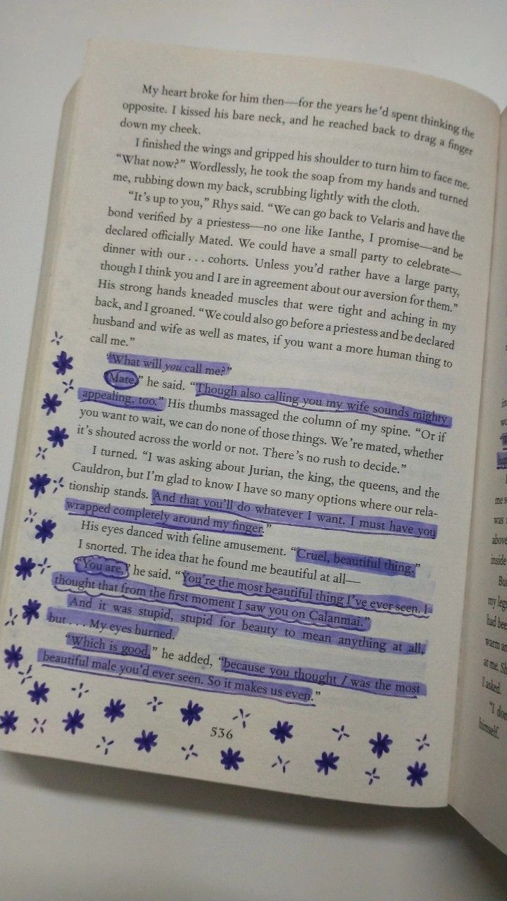 an open book with blue writing on it