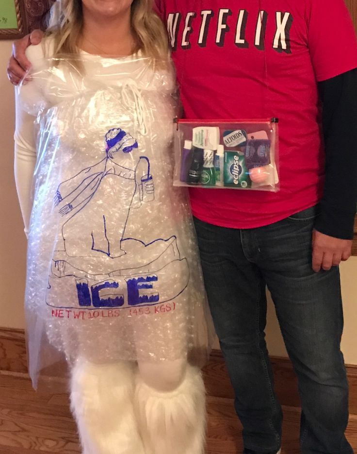 a man and woman standing next to each other in plastic bags with toothpaste on them