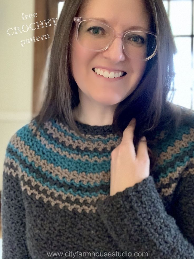 a woman wearing glasses is smiling and posing for the camera with her hand on her shoulder