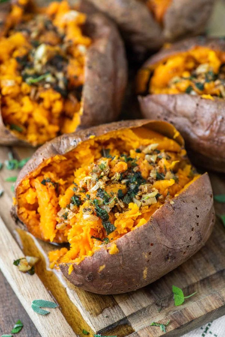 baked sweet potatoes on a cutting board with text overlay