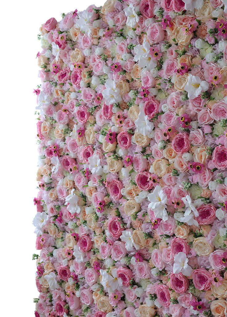 a wall covered in pink and white flowers