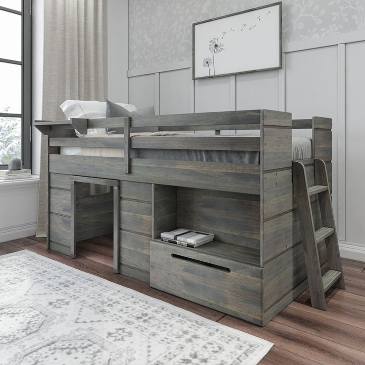 a wooden bunk bed sitting on top of a hard wood floor next to a window